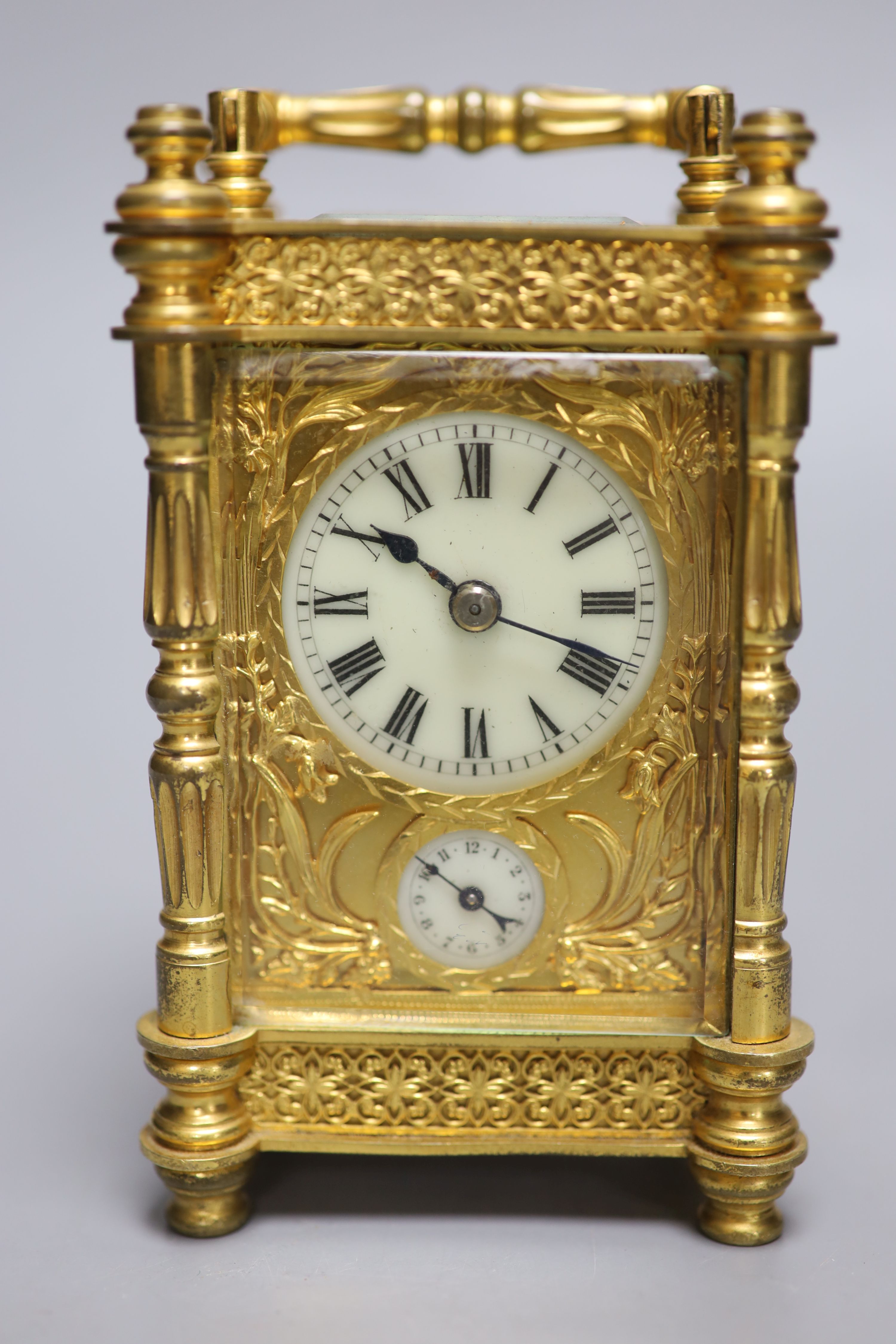 An early 20th century French brass carriage clock, with alarm, height 13.5cm with handle down